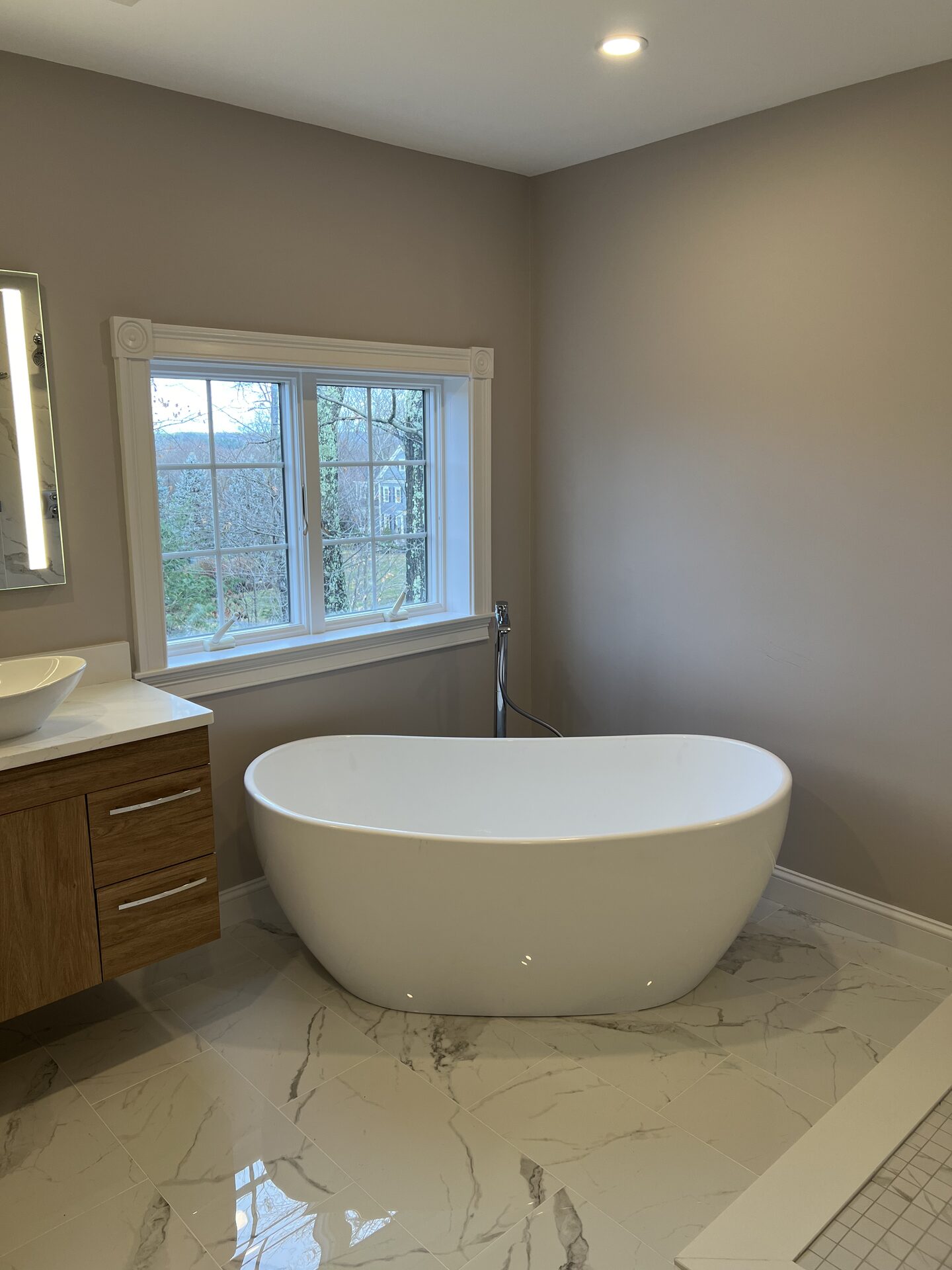 Freestanding Soaking Tub & Marble-Look Floor in Holliston, MA