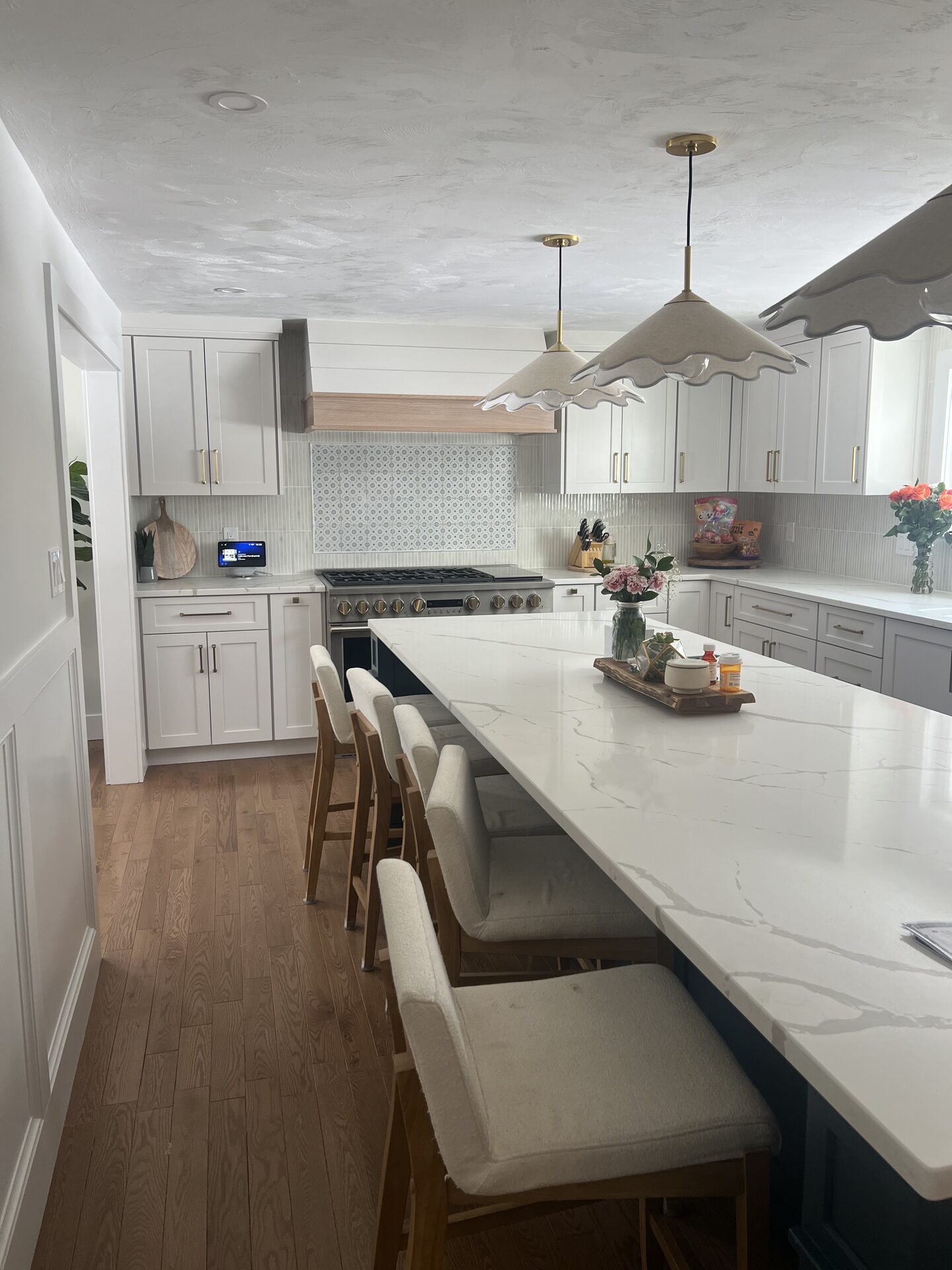 Quartz Island Kitchen with Brass Pendants in MetroWest, MA