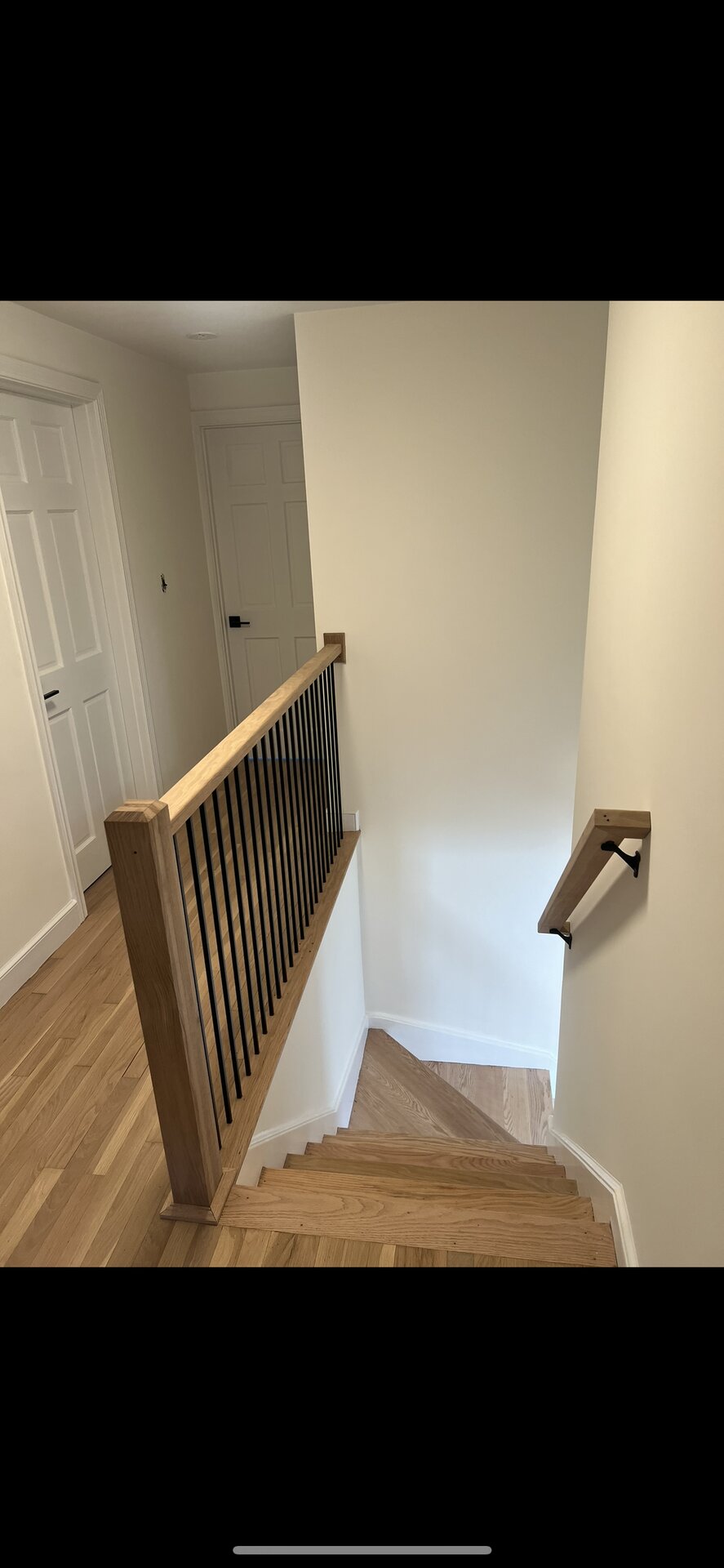 Modern Staircase with Iron Balusters in MetroWest, MA